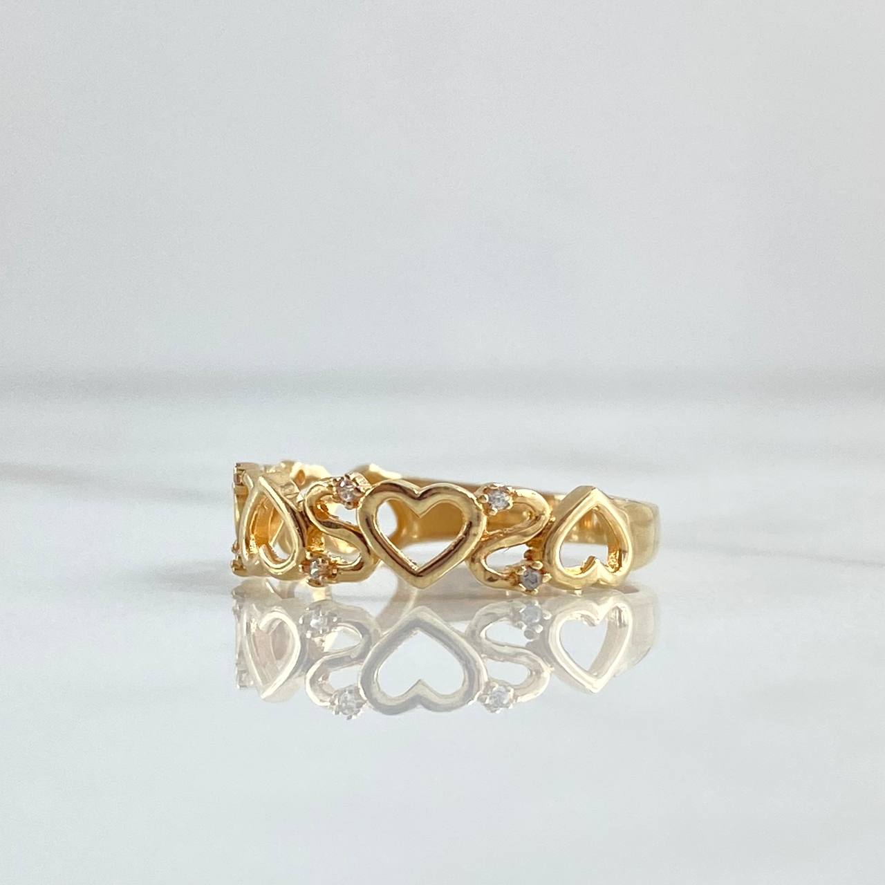 Anillo Hilera Corazones 2.05gr / T7 / Circones Blancos Oro Amarillo 18K