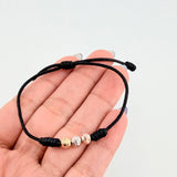Pulsera Negra Trío Bolas 3und / 5mm Tres Oros 18K  (A.C)
