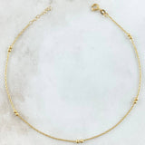 Tobillera Aro Seguido 1.5gr / 23cm-24.5cm / 1mm Bolas Lisas 2mm Oro Amarillo +4 18K