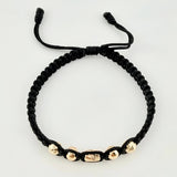 Pulsera Negra Cilindro Central 5und / 4mm-5mm Oro Amarillo 18K *