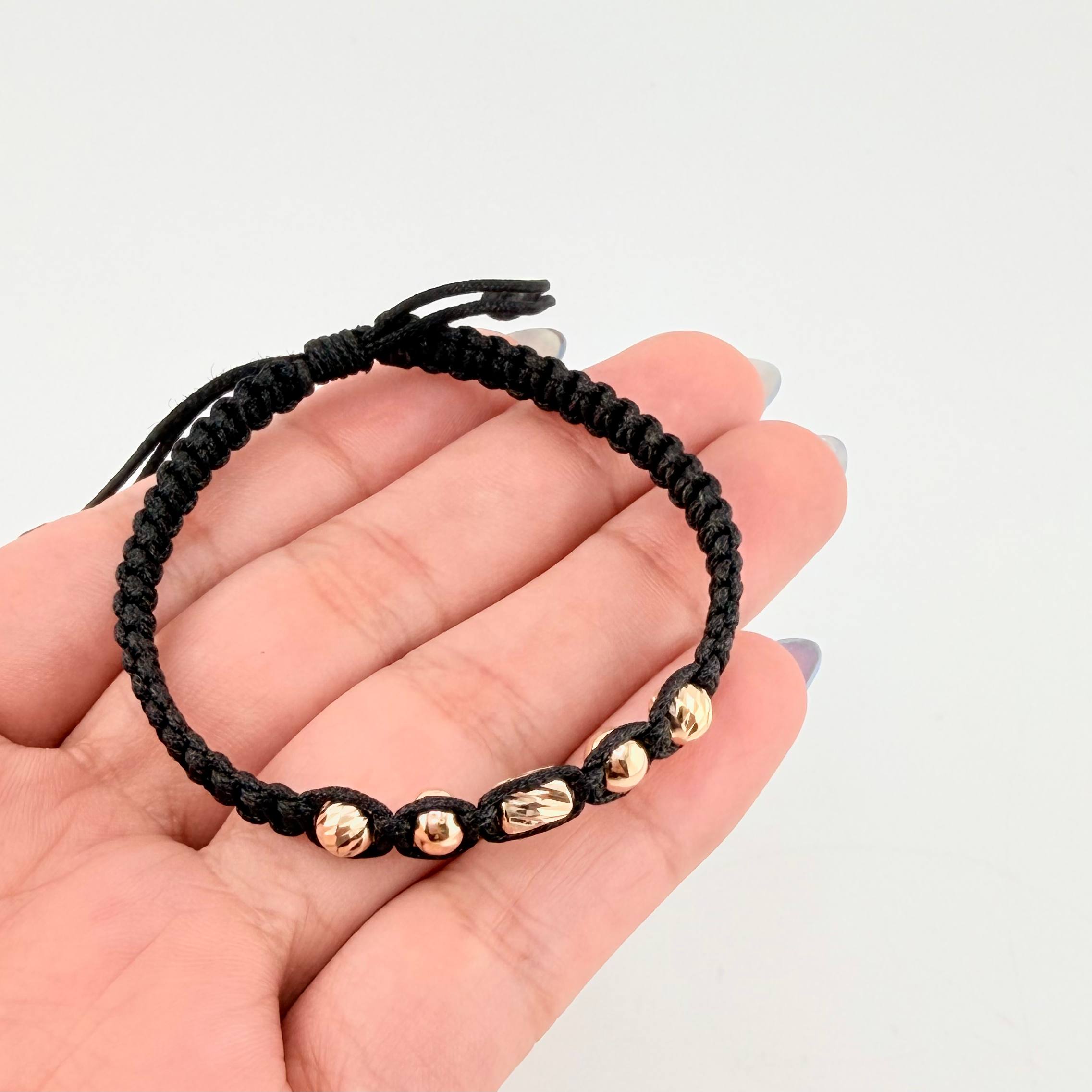 Pulsera Negra Cilindro Central 5und / 4mm-5mm Oro Amarillo 18K *