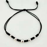 Pulsera Negra Secuencia Lisa 5und / 3mm-5mm Oro Blanco 18K *