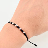 Pulsera Negra Secuencia Lisa 5und / 3mm-5mm Oro Blanco 18K *