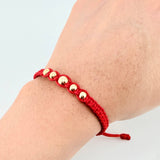 Pulsera Roja Bolas Pentatonicas 5und / 5mm-6mm Oro Amarillo 18K *