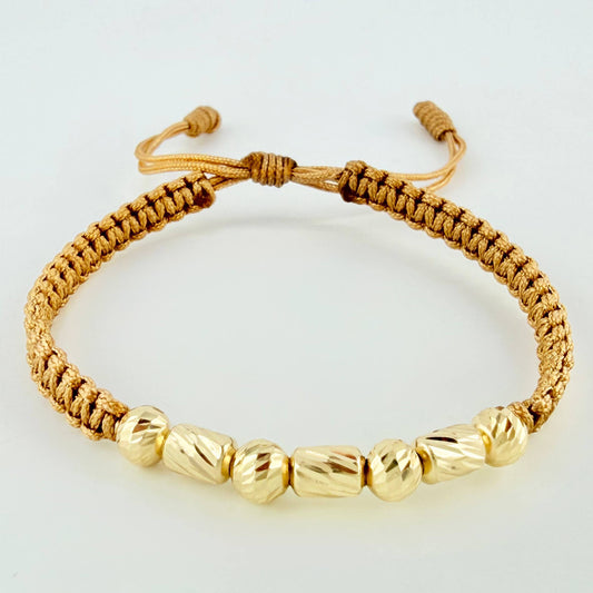 Pulsera Dorada Cilindros Interceptos 7und / 4mm-5mm Oro Amarillo 18K *
