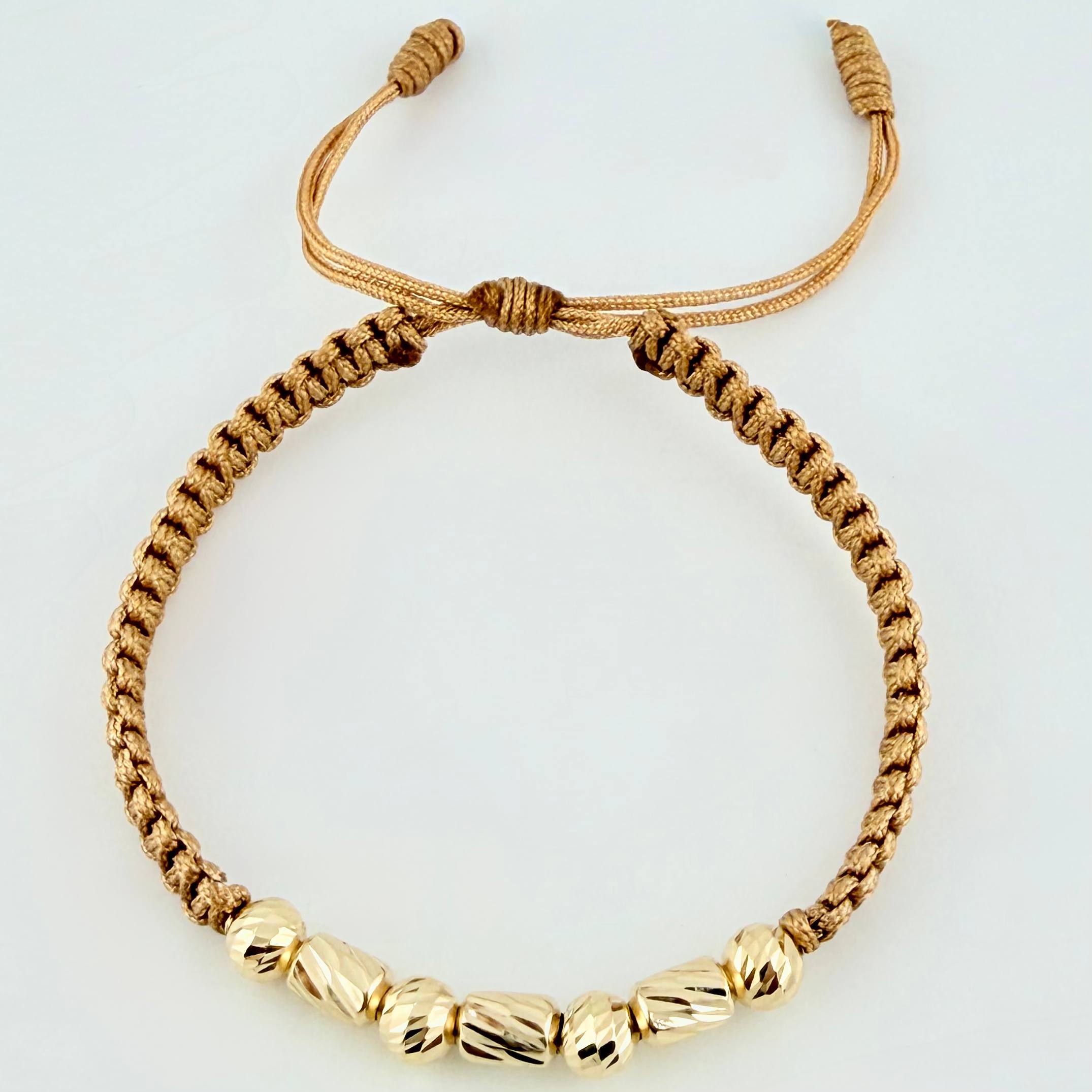Pulsera Dorada Cilindros Interceptos 7und / 4mm-5mm Oro Amarillo 18K *