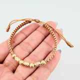 Pulsera Dorada Cilindros Interceptos 7und / 4mm-5mm Oro Amarillo 18K *