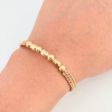 Pulsera Dorada Cilindros Interceptos 7und / 4mm-5mm Oro Amarillo 18K *