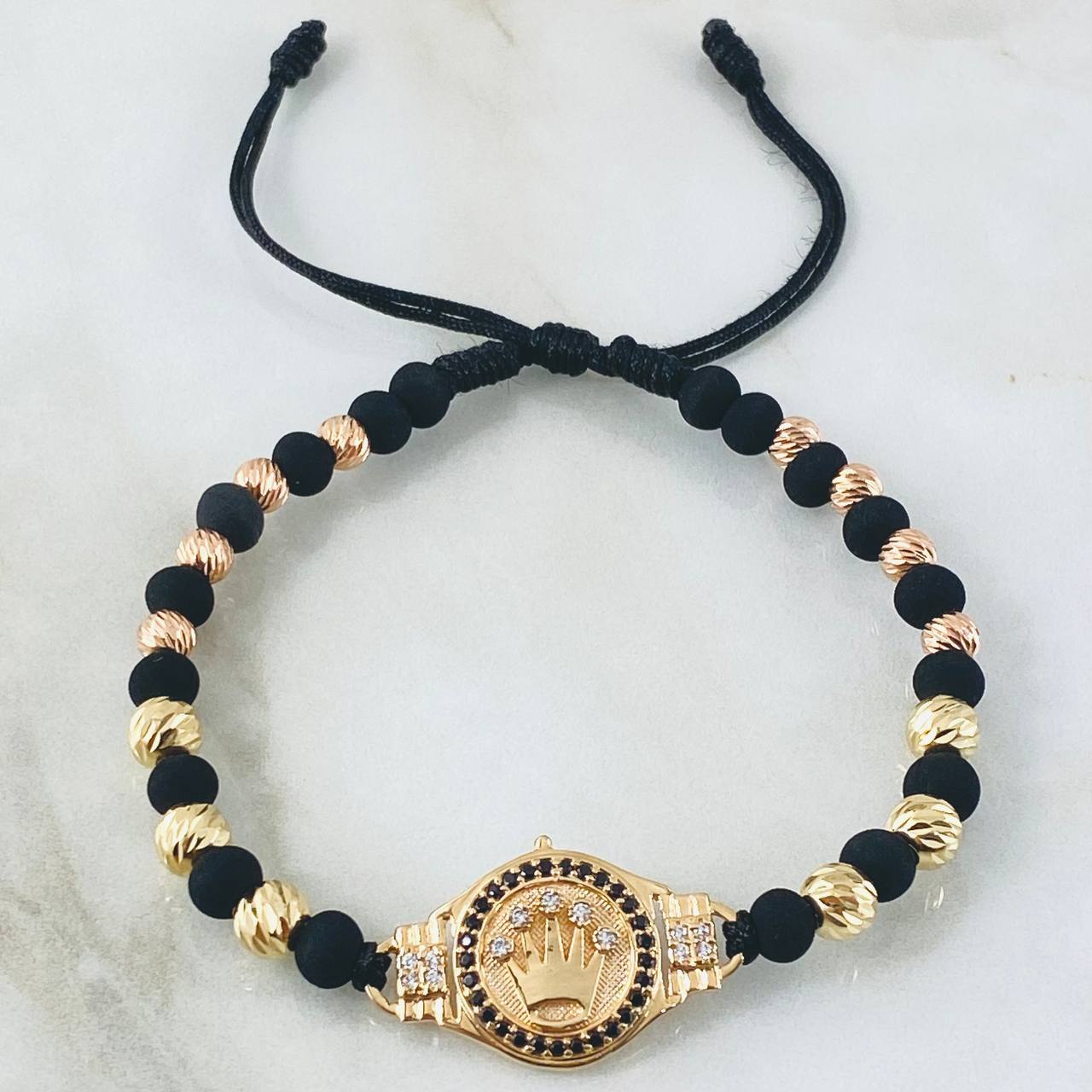 Pulsera Negra Herraje Corona 6.8gr / Dos Oros Amarillo Rosa 18K ©