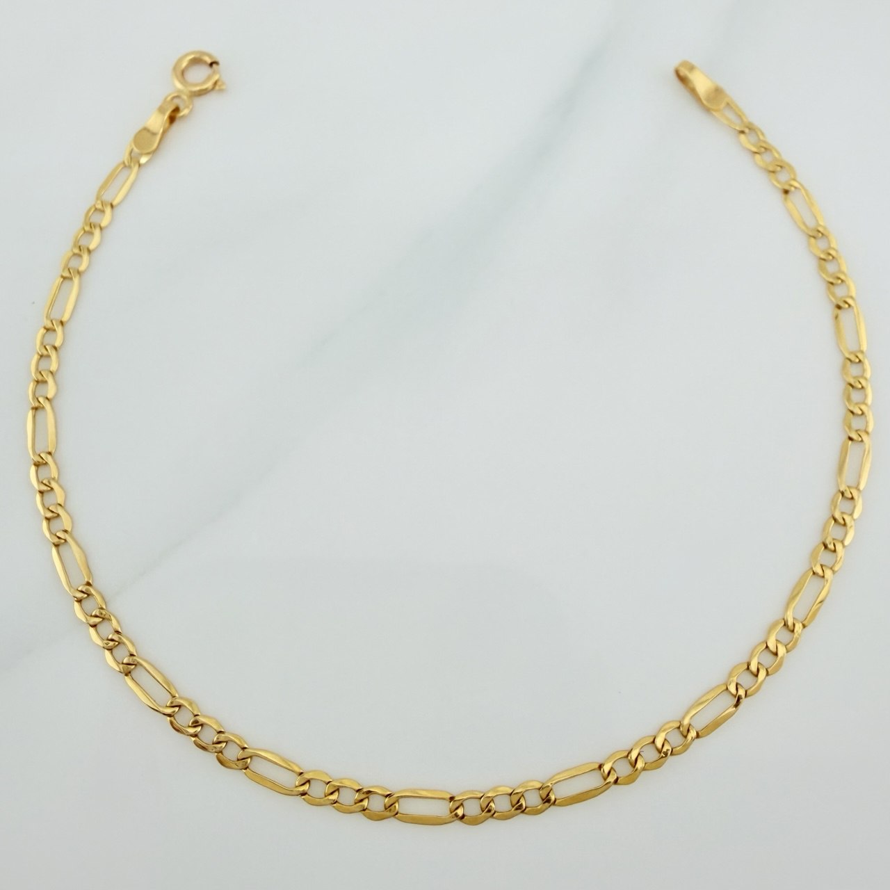 Pulso Figaro 1.15gr / 19cm / 2.3mm Oro Amarillo +1 18K $