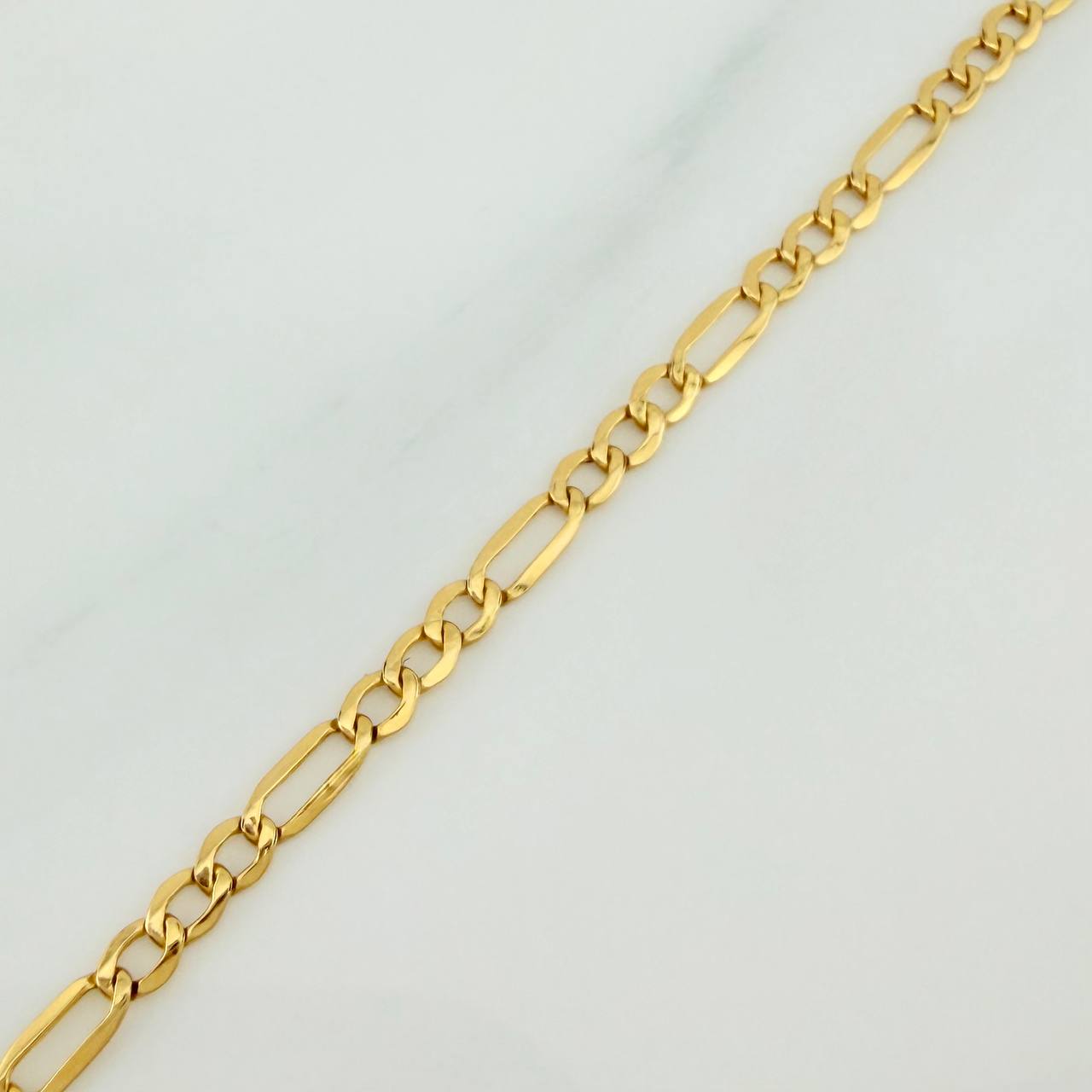 Pulso Figaro 1.15gr / 19cm / 2.3mm Oro Amarillo +1 18K $