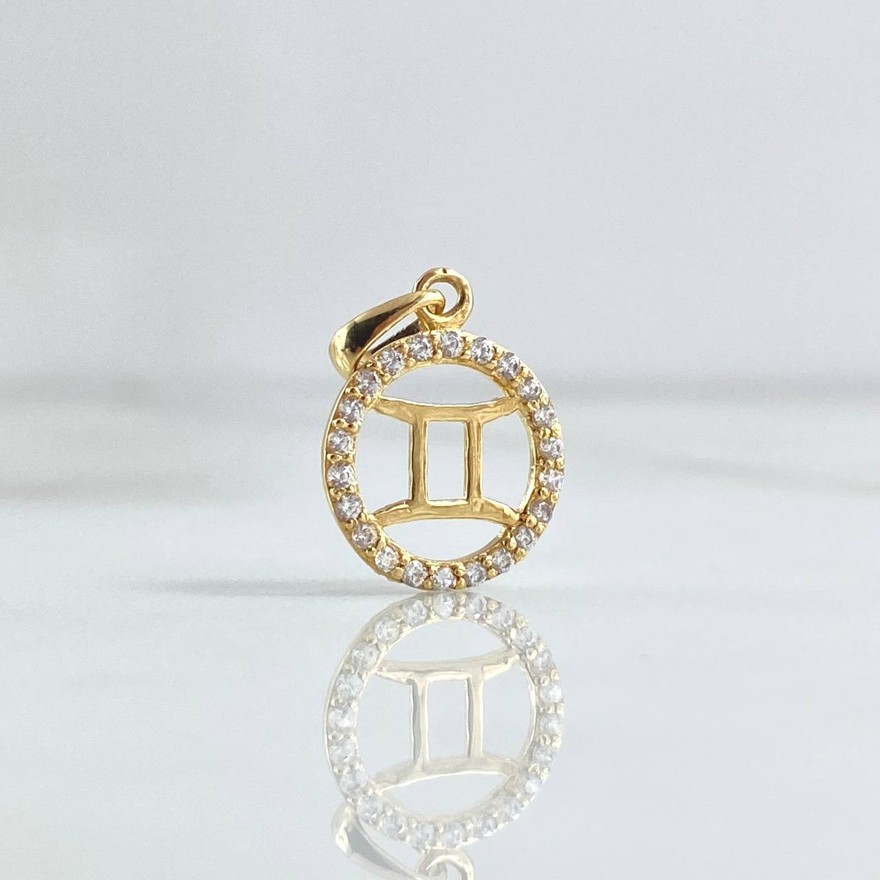 Dije Signo Géminis 0.95gr / 2cm / Circones Blancos Oro Amarillo 18K