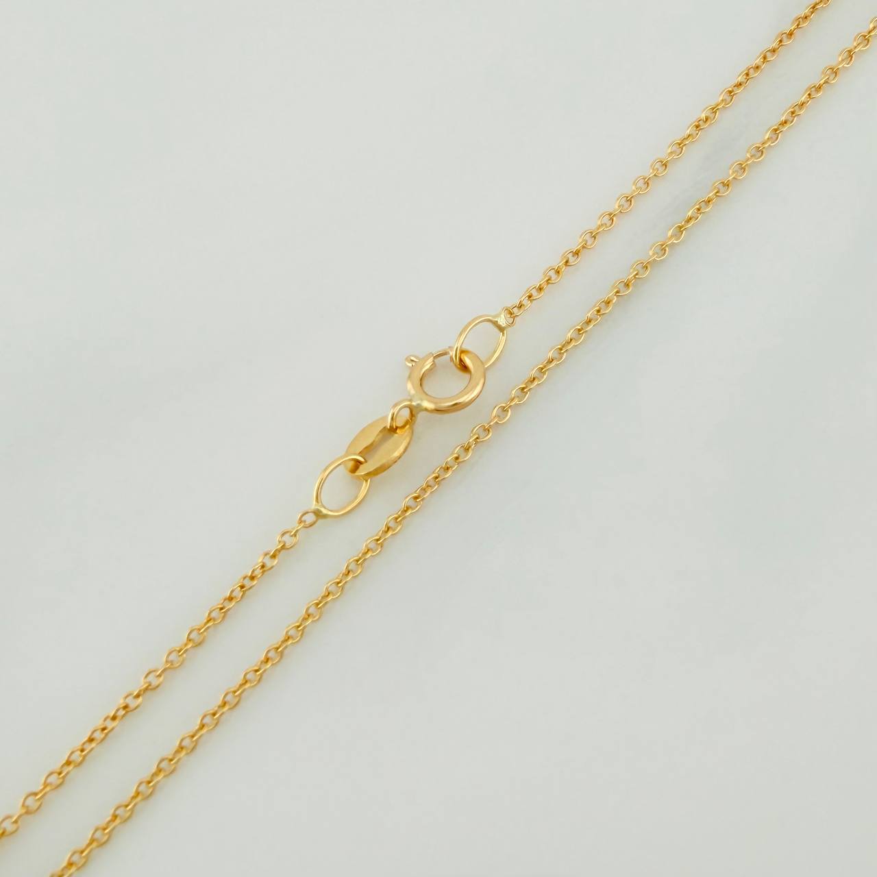 Cadena Aro Seguido 1.25gr / 45.3cm / 0.6mm Oro Amarillo +3 18K %
