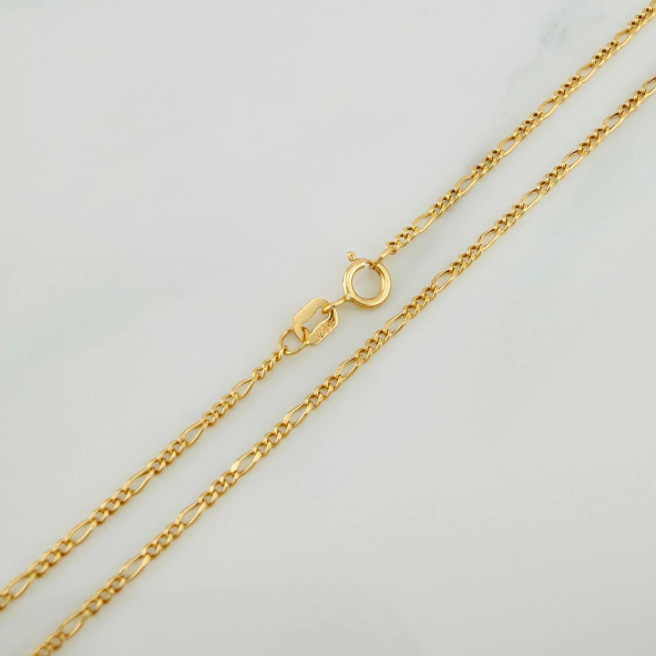 Cadena Figaro 1.4gr / 45cm / 1.1mm Oro Amarillo +1 18K %