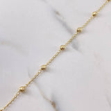 Tobillera Tipo Militar 2.5gr / 25.6cm / 3.6mm Bolas Diamantadas Oro Amarillo 18K $
