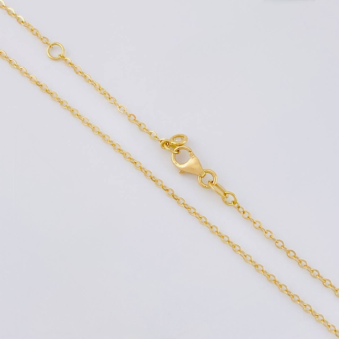 Cadena Aro Seguido Cruz Lateral 2.55 g / 45.5 cm / 1.4 mm Oro Amarillo 18K