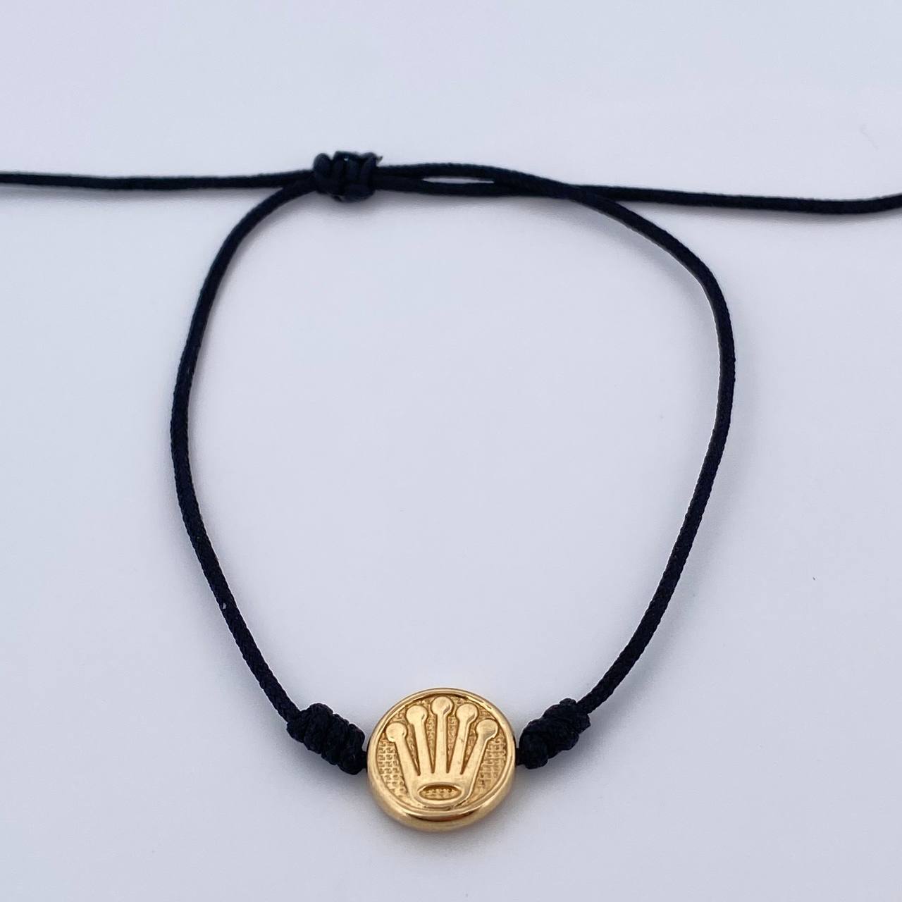 Pulsera Tejida Negra Corona Rx 0.55gr / Oro Amarillo 18K $