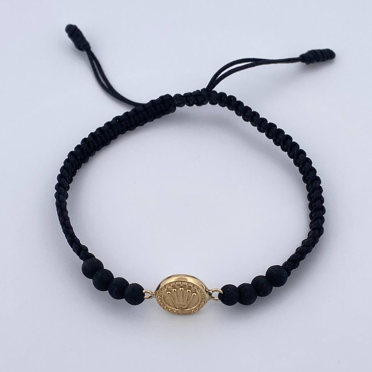 Pulsera Tejida Negra Corona Rx 0.65gr / Oro Amarillo 18K $
