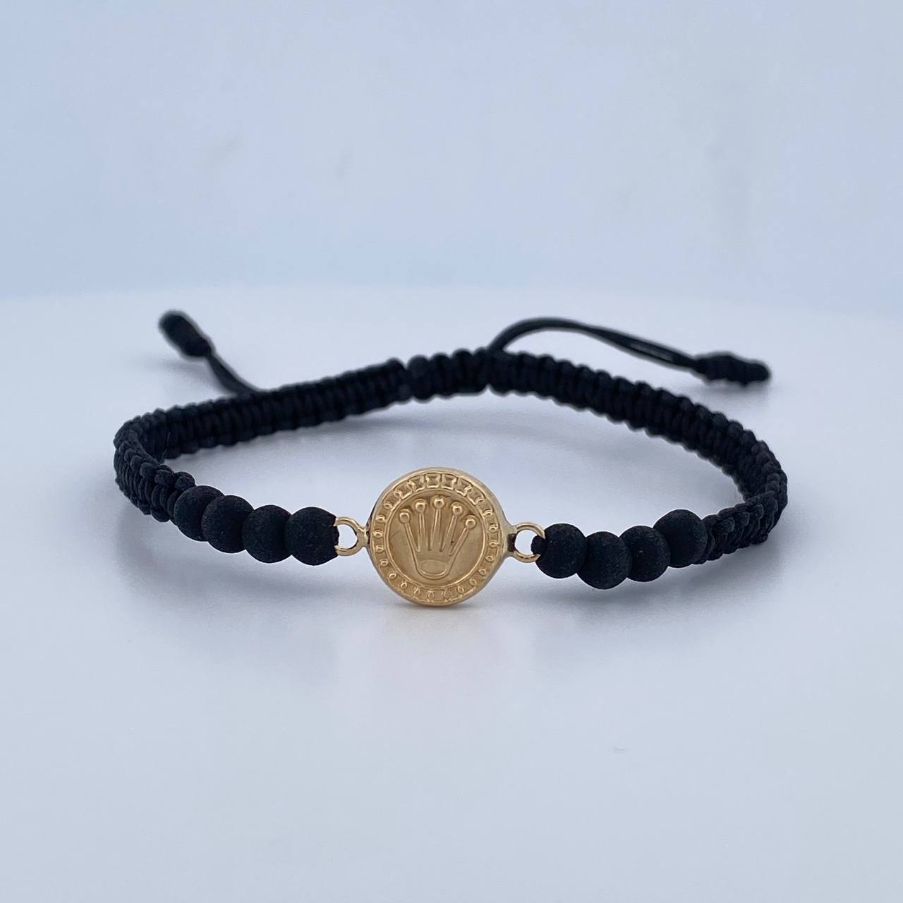 Pulsera Tejida Negra Corona Rx 0.65gr / Oro Amarillo 18K $