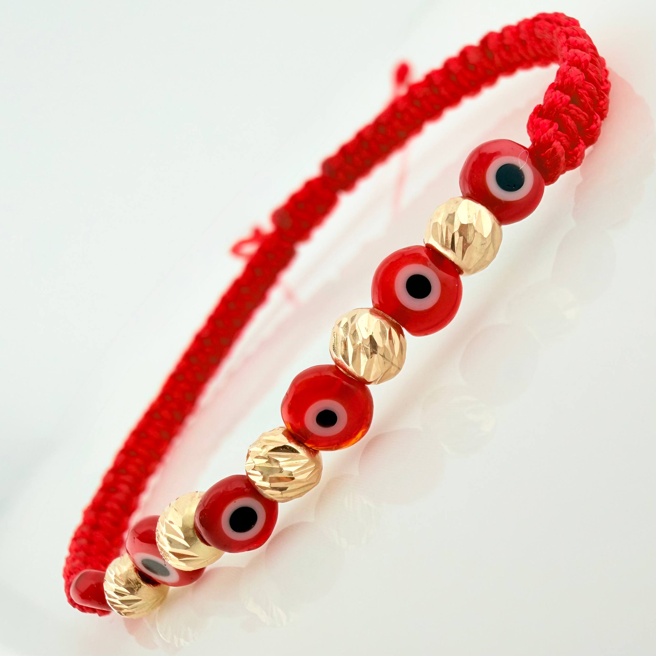 Pulsera Tejida Roja Ojos Turcos Oro Amarillo 18K