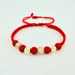 Pulsera Tejida Roja Bolas de Fuego Bolas Diamantadas Oro Amarillo 18K