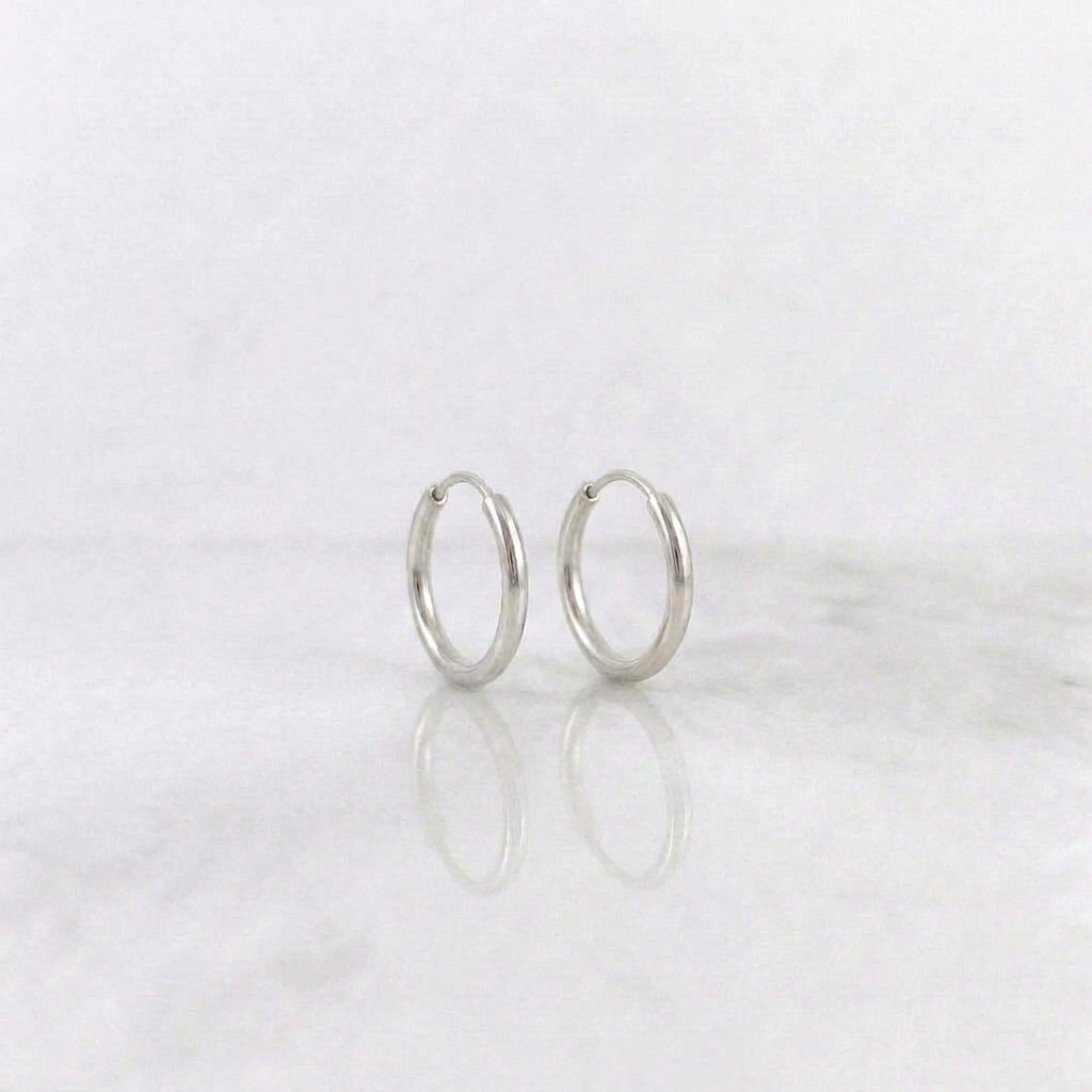 Candongas Aro Liso 0.4gr / 1.1cm / Oro Blanco 18K