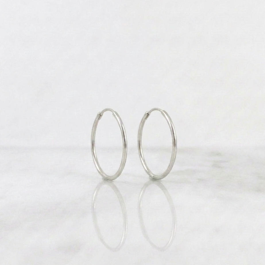 Candongas Aro Liso 0.6gr / 1.4cm / Oro Blanco 18K