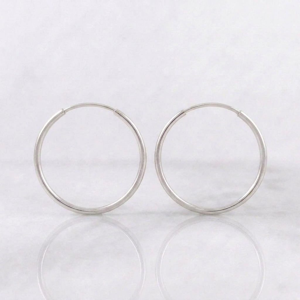 Candongas Aro Liso 0.7gr / 1.6cm / Oro Blanco 18K