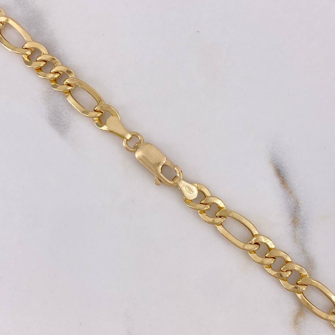 Cadena Figaro 10gr / 60cm / 5.3mm Oro Amarillo +1 18K $