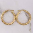 Candongas Mary 2.65gr / 2.7cm / Entorchadas Oro Amarillo 18K $