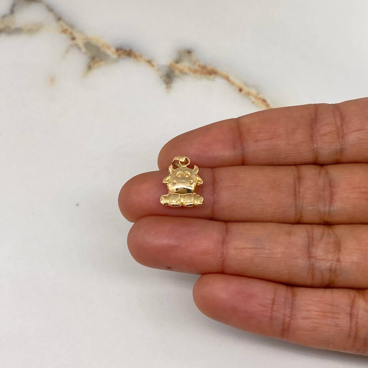 Dije Vaca 0.7gr / 2cm / Troquelado Oro Amarillo $