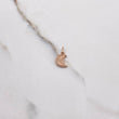Dije Rostro Media Luna 0.4gr / 2cm / Liso Oro Rosa $