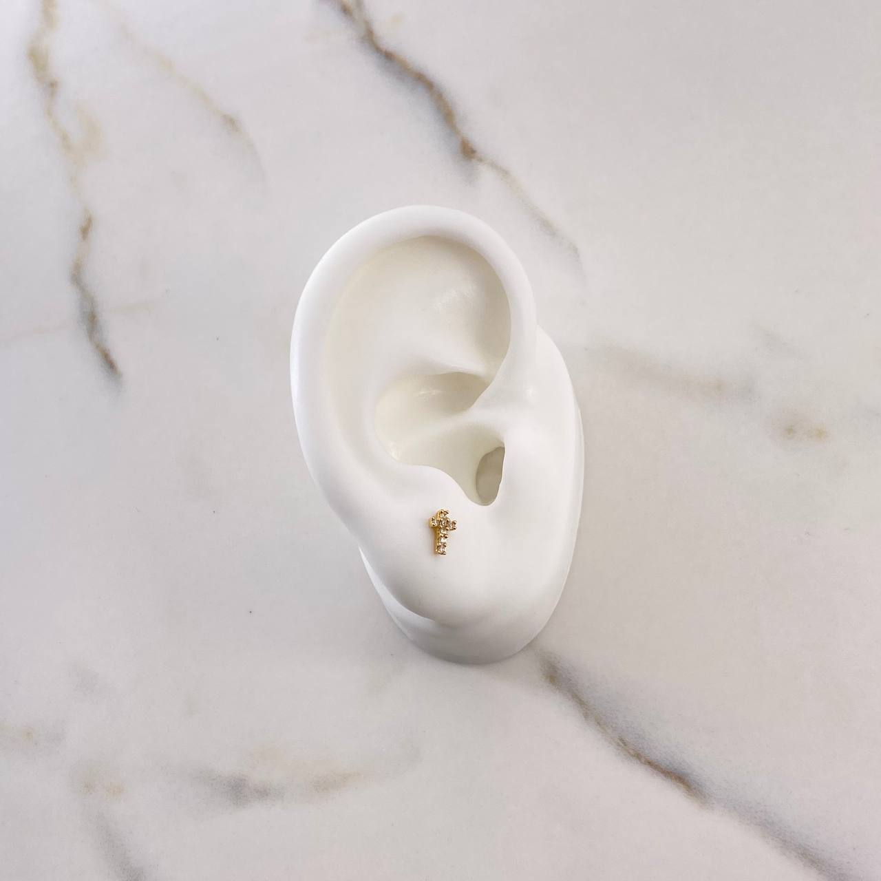 Topos Cruz 0.65gr / 6mm / Circones Blancos Oro Amarillo $