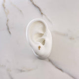 Topos Cruz 0.65gr / 6mm / Circones Blancos Oro Amarillo $