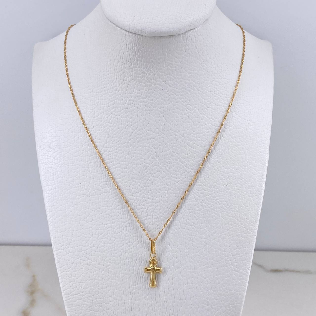 Cadena Singapur 0.85gr / 50cm + Dije Cruz Anj 0.4gr / 2cm / Oro Amarillo (Oferta) $