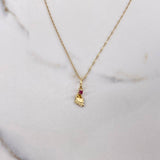 Cadena Singapur 0.75gr / 45cm + Dije Pie Circon Fucsia 0.25gr / 1.8cm / Oro Amarillo (Oferta) $