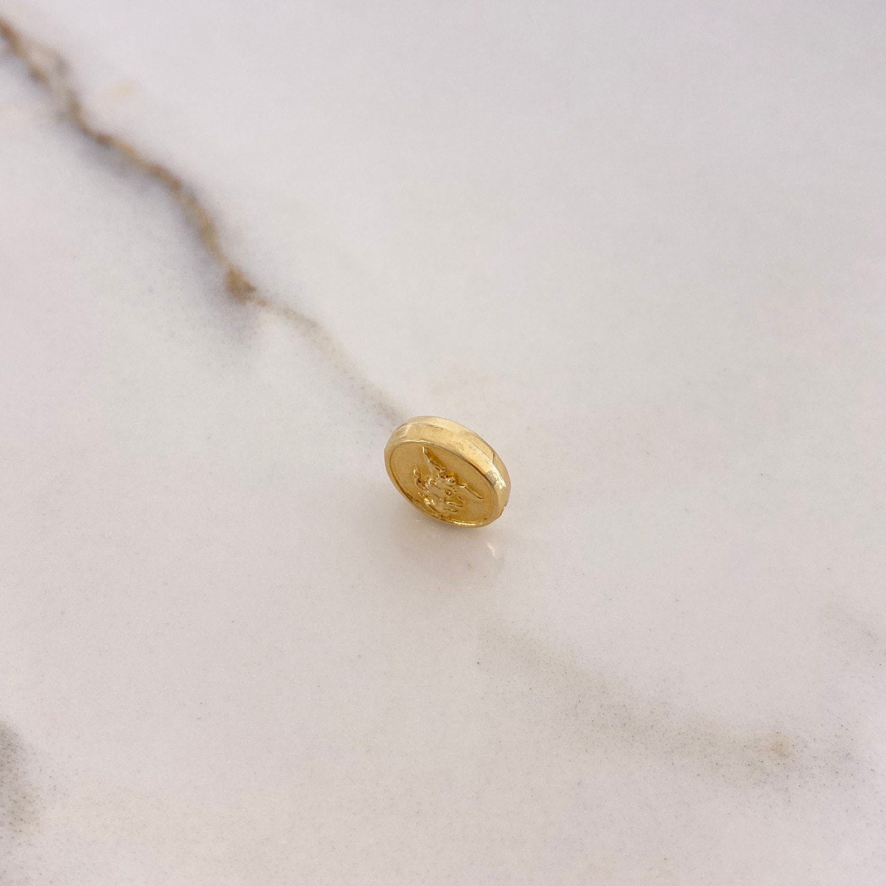 Herraje San Miguel Arcángel Tambor 0.55gr / 1cm / Troquelado Oro Amarillo $