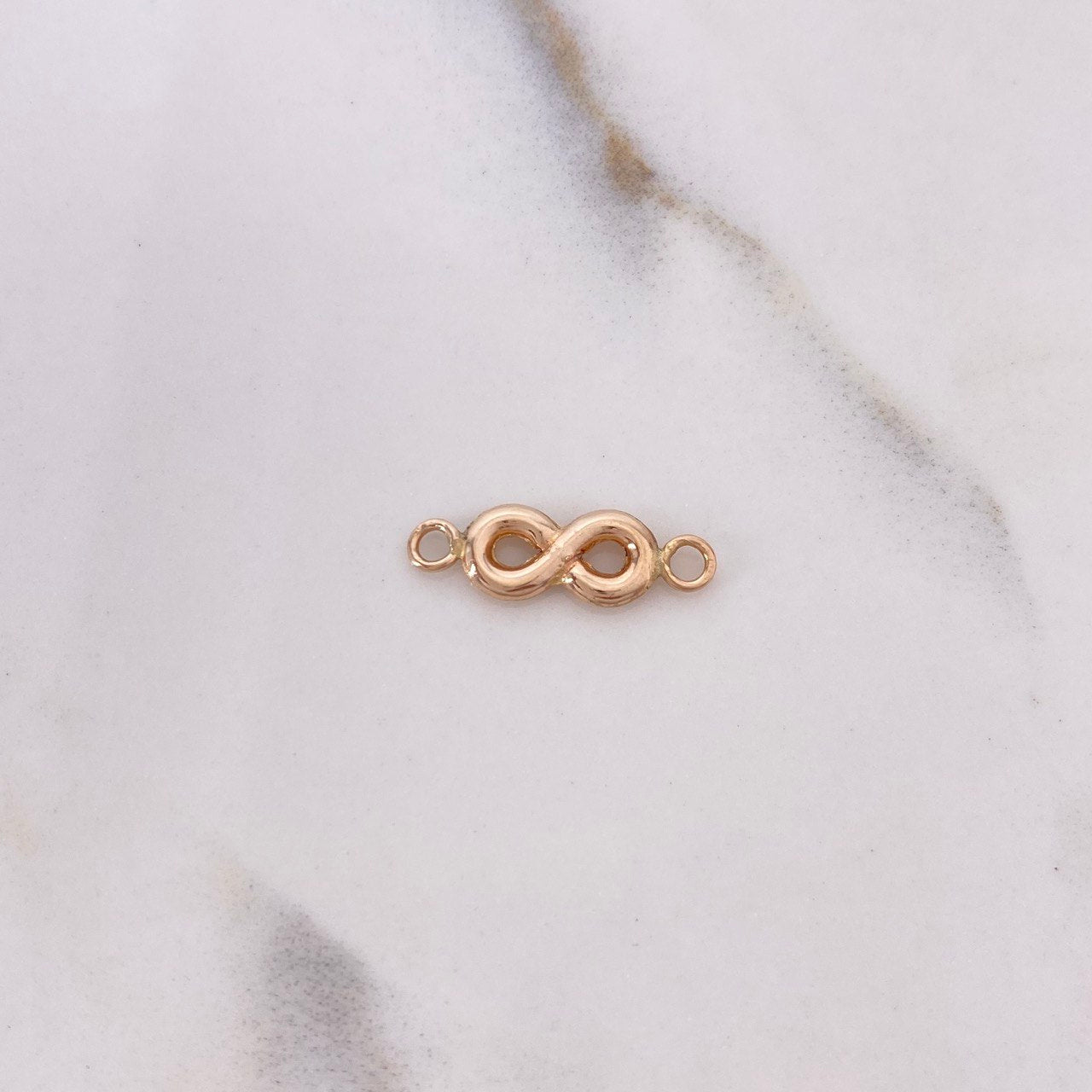 Herraje Infinito 0.35gr / 1.5cm / Oro Rosa $