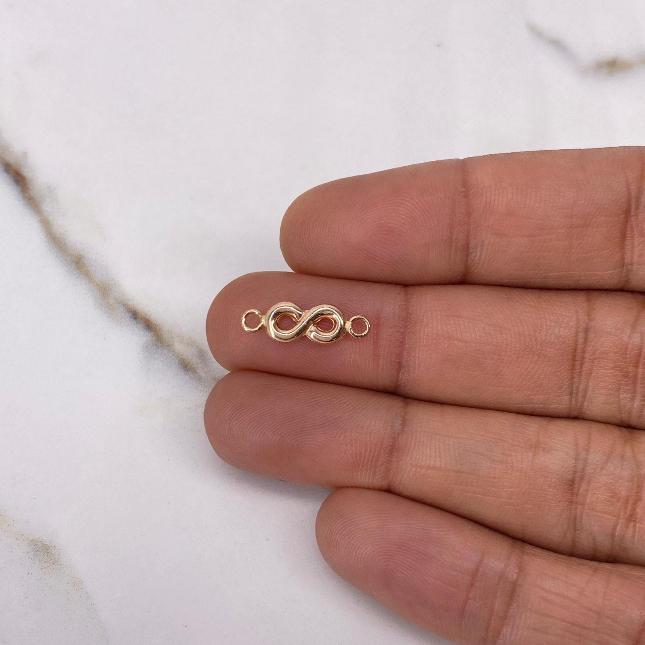Herraje Infinito 0.35gr / 1.5cm / Oro Rosa $