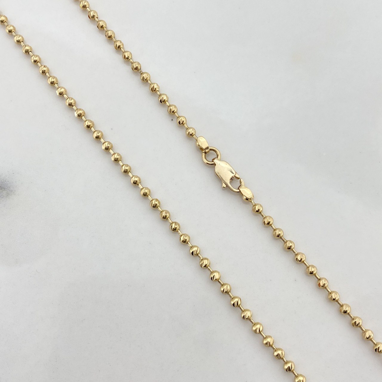 Cadena Militar 12.75gr / 55cm / 2.3mm Bolas Diamantadas Oro Amarillo $
