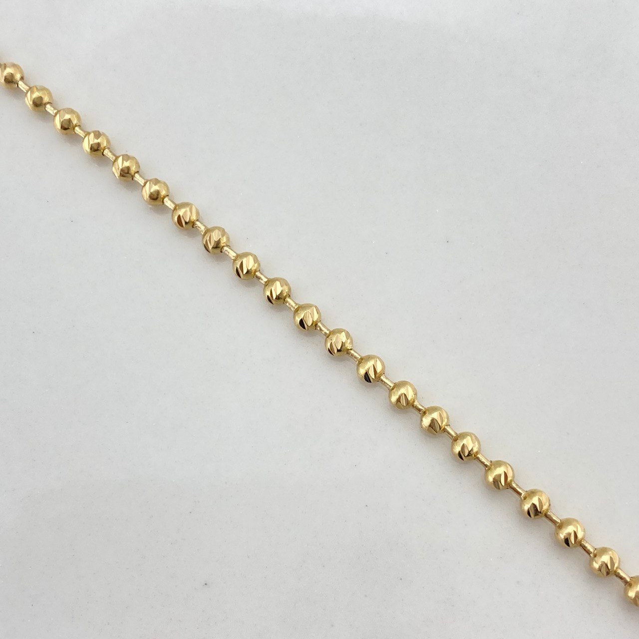 Cadena Militar 12.75gr / 55cm / 2.3mm Bolas Diamantadas Oro Amarillo $