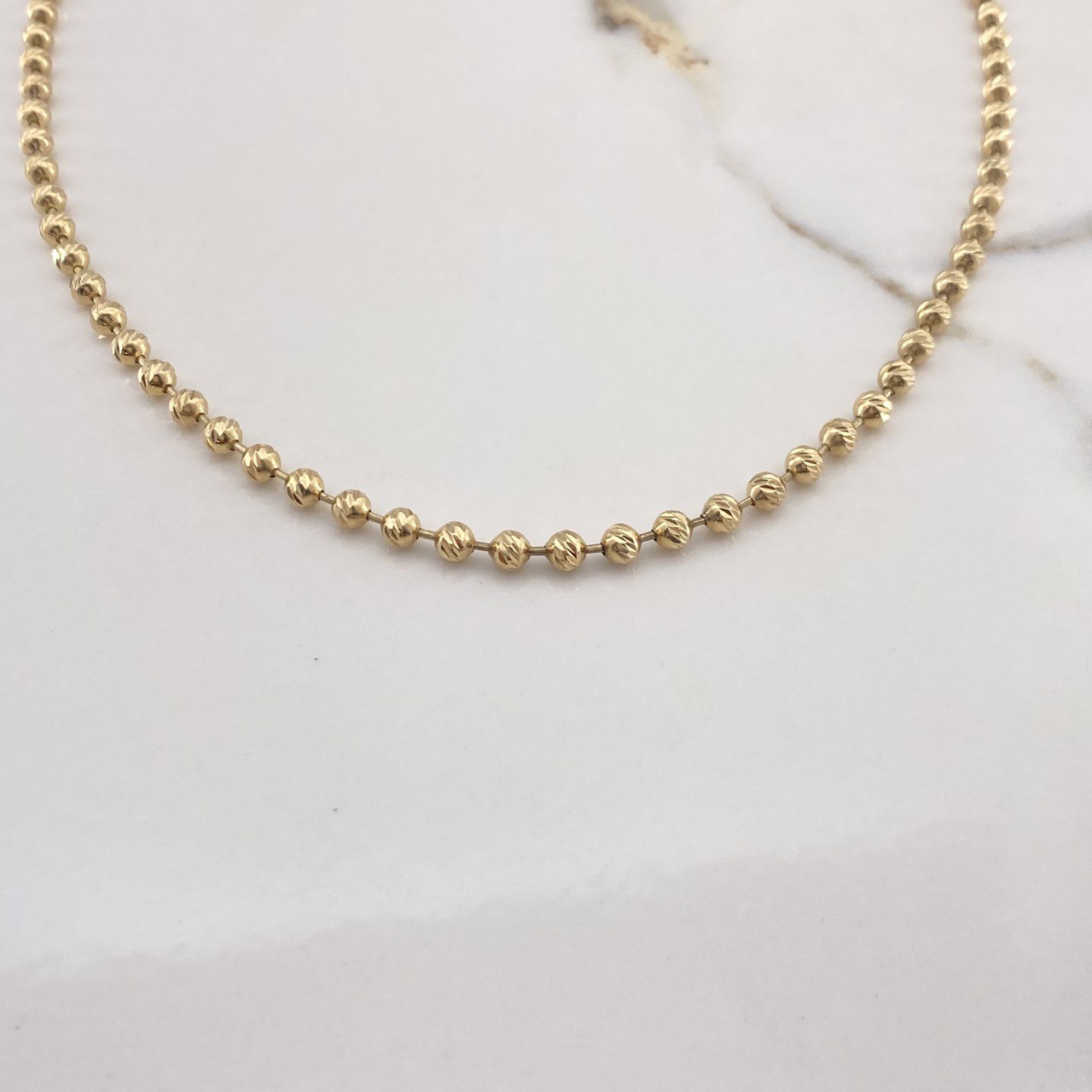 Cadena Militar 25.45gr / 65cm / 4mm Bolas Diamantadas Oro Amarillo $
