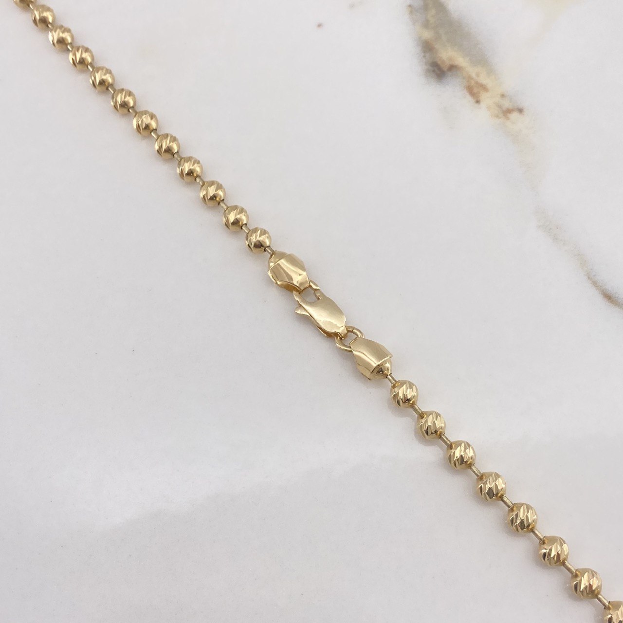 Cadena Militar 25.45gr / 65cm / 4mm Bolas Diamantadas Oro Amarillo $