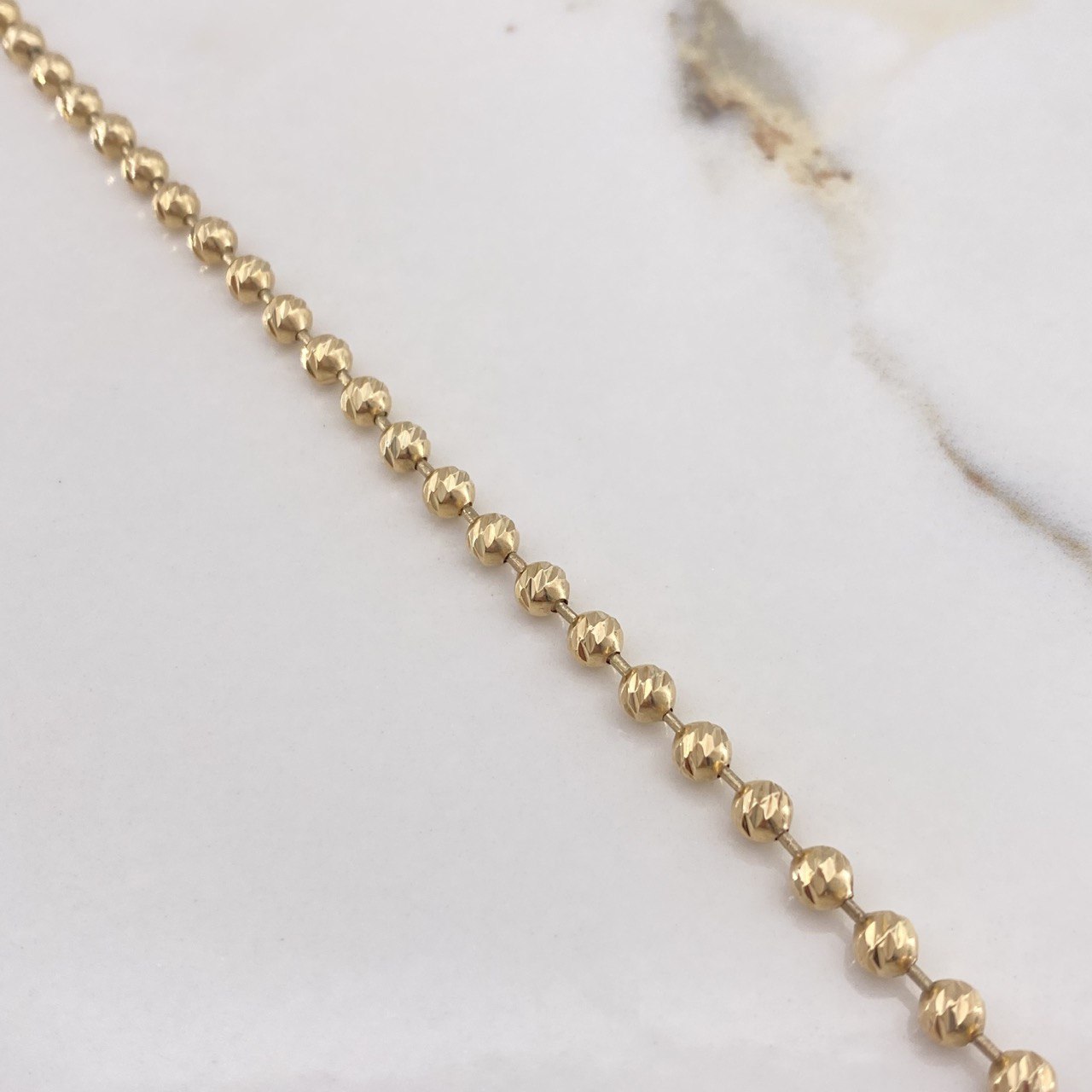 Cadena Militar 25.45gr / 65cm / 4mm Bolas Diamantadas Oro Amarillo $