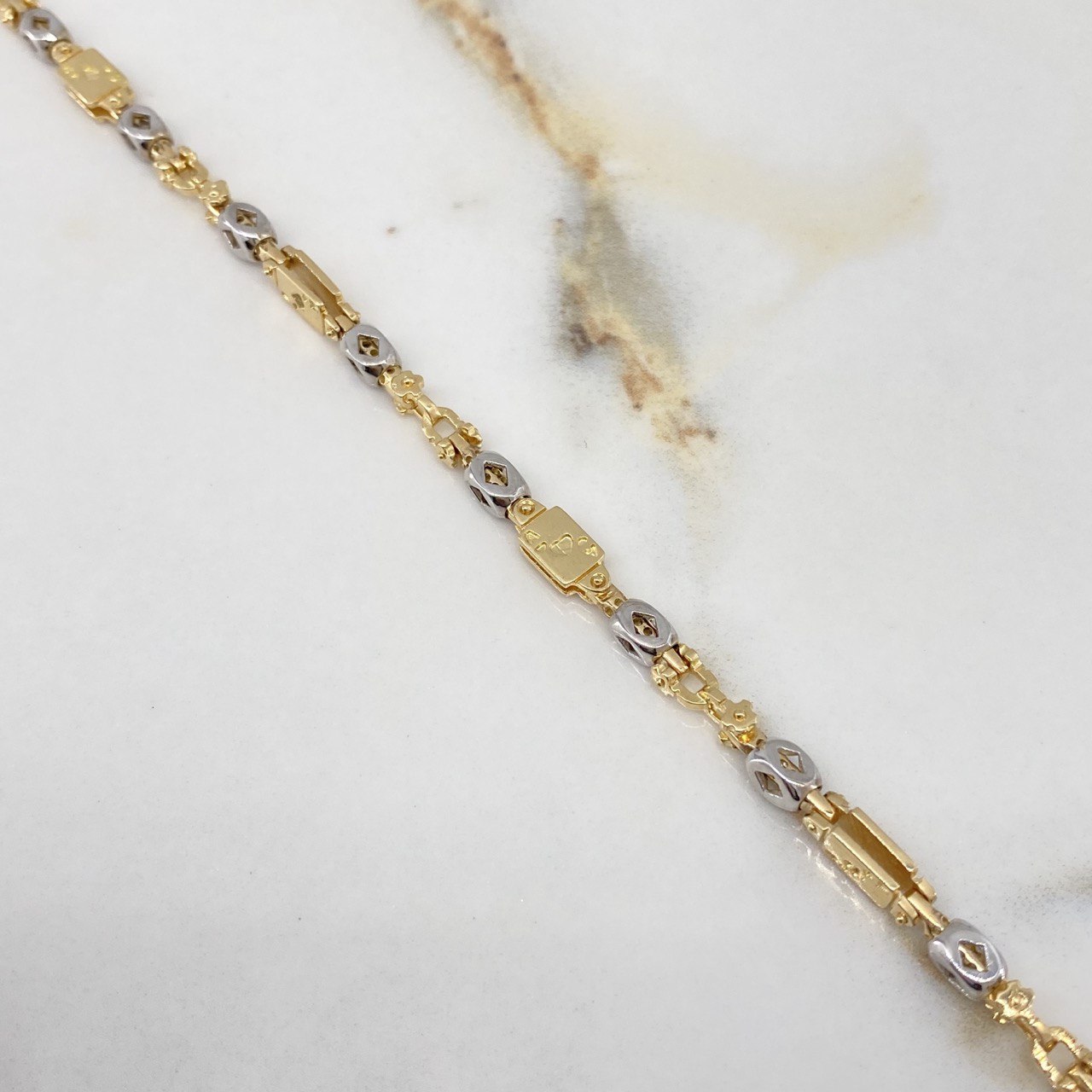 Cadena Rustica Poker 51.6gr / 60cm / 4.7mm Dos Oros Amarillo Blanco $