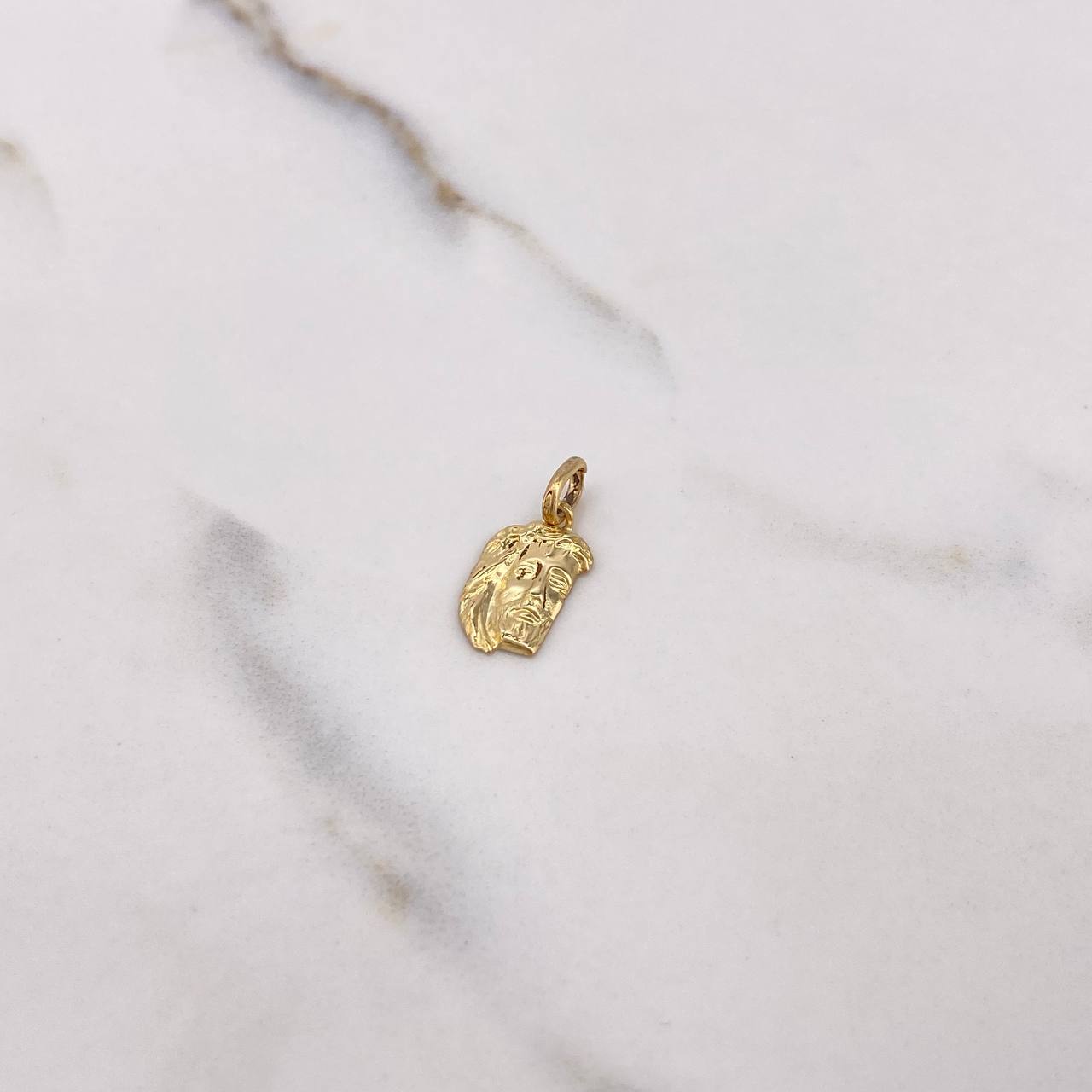 Dije Rostro de Cristo 0.65gr / 1.9cm / Oro Amarillo $