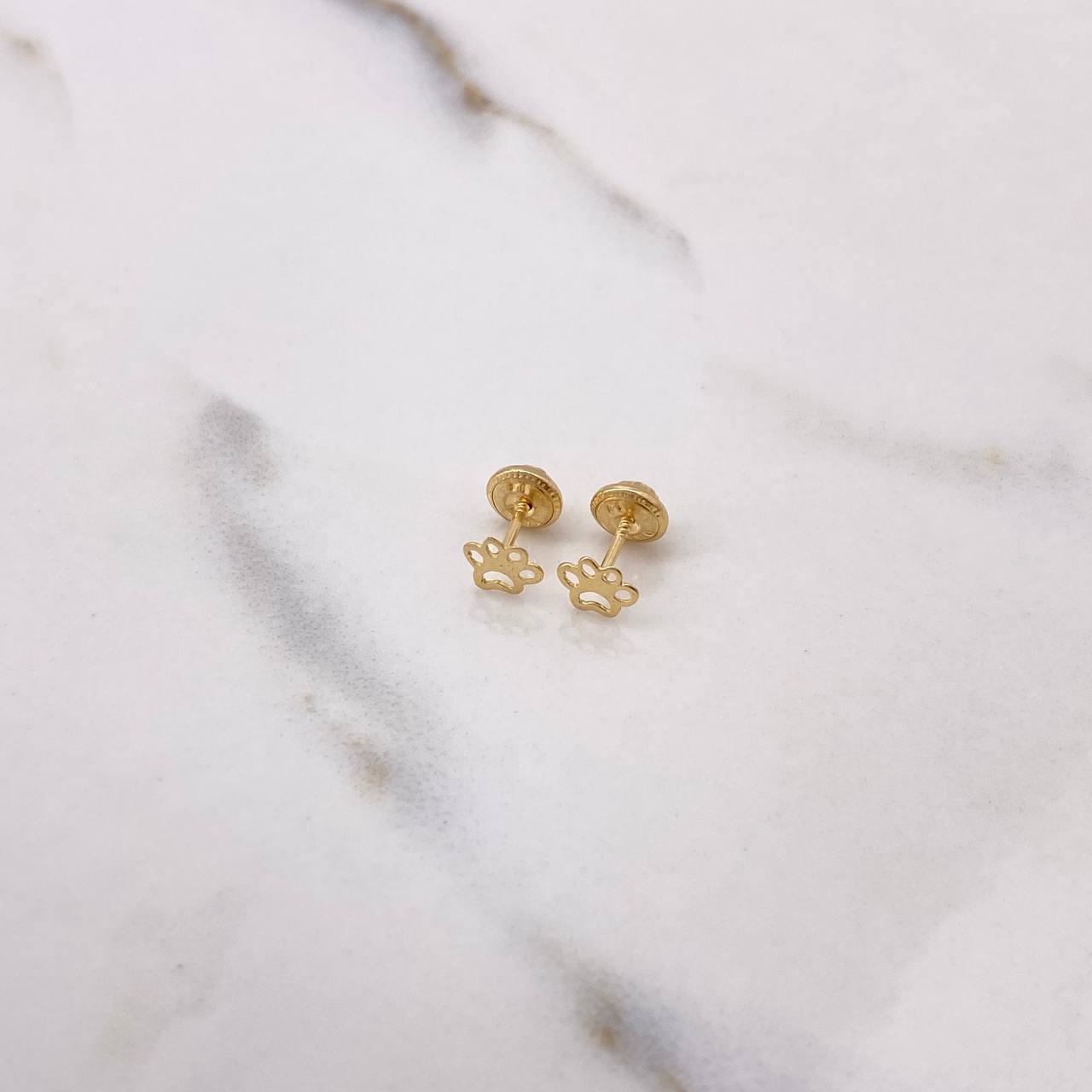 Topos Huella Silueta 0.45gr / Oro Amarillo $