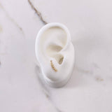 Topos Linea 0.75gr / Circones Blancos Oro Amarillo $