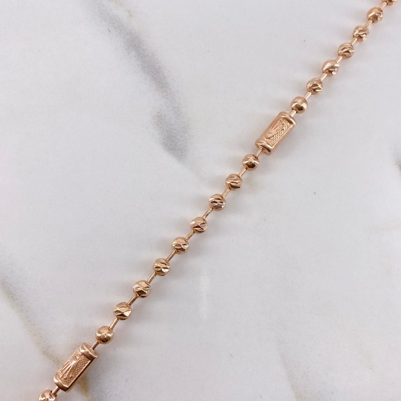Tobillera Militar Corona 9.55gr / 28.5cm / 3mm-4mm Bolas Lisa-Diamantadas Oro Rosa $