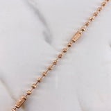 Tobillera Militar Corona 9.55gr / 28.5cm / 3mm-4mm Bolas Lisa-Diamantadas Oro Rosa $